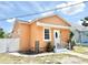 Charming single-story home featuring a stucco exterior, inviting front entrance, and well-maintained landscaping at 2137 W Saint Louis St, Tampa, FL 33607