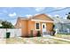 Charming single-story home featuring a stucco exterior, inviting front entrance, and well-maintained landscaping at 2137 W Saint Louis St, Tampa, FL 33607