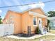 Charming single-story home featuring a stucco exterior, inviting front entrance, and well-maintained landscaping at 2137 W Saint Louis St, Tampa, FL 33607