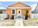 Charming single-story home featuring a stucco exterior, inviting front entrance, and well-maintained landscaping at 2137 W Saint Louis St, Tampa, FL 33607