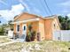 Charming single-story home featuring a stucco exterior, inviting front entrance, and well-maintained landscaping at 2137 W Saint Louis St, Tampa, FL 33607