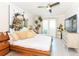 Comfortable bedroom with a large modern art piece above the bed and a ceiling fan at 2335 Beneva Ter # 2254, Sarasota, FL 34232