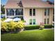 Two-story condo featuring a balcony, well-kept lawn, and lush landscaping at 2335 Beneva Ter # 2254, Sarasota, FL 34232