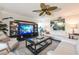 Bright living room with stylish decor, large TV, neutral furniture and a ceiling fan at 2335 Beneva Ter # 2254, Sarasota, FL 34232
