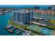 Panoramic view of bayside community with waterfront condos, a private marina, and tennis courts at 240 Sand Key Estates Dr # 222, Clearwater, FL 33767