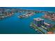 Aerial view showcases bayside condo community with tennis courts and private boat docks at 240 Sand Key Estates Dr # 222, Clearwater, FL 33767