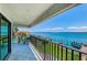 Enjoy beautiful waterfront views from this spacious balcony with outdoor seating area at 240 Sand Key Estates Dr # 222, Clearwater, FL 33767
