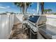 Outdoor grilling area features stainless steel grills and brick flooring, perfect for entertaining at 240 Sand Key Estates Dr # 222, Clearwater, FL 33767