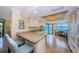 Well-equipped kitchen with granite countertops, stainless steel appliances, and breakfast bar at 240 Sand Key Estates Dr # 222, Clearwater, FL 33767
