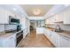 Spacious kitchen featuring modern appliances, granite countertops, and ample cabinet space at 240 Sand Key Estates Dr # 222, Clearwater, FL 33767