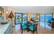 Bright living space with comfortable seating, water views, and access to the balcony at 240 Sand Key Estates Dr # 222, Clearwater, FL 33767