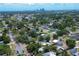 Panoramic view of a suburban community with mature trees and a distant city skyline, highlighting the location at 2627 17Th N Ave, St Petersburg, FL 33713