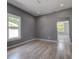 Neutral painted bedroom with sleek flooring, recessed lights, and a hallway entrance at 2627 17Th N Ave, St Petersburg, FL 33713