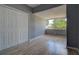 This bedroom offers natural light, neutral paint, and durable laminate flooring at 2627 17Th N Ave, St Petersburg, FL 33713