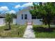 A cozy home with a tidy front yard featuring healthy landscaping and a sidewalk at 2627 17Th N Ave, St Petersburg, FL 33713