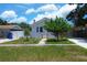 Charming home with an inviting front yard and well-manicured lawn on a beautiful day at 2627 17Th N Ave, St Petersburg, FL 33713