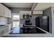 Updated kitchen featuring marble countertops, white cabinetry and modern appliances at 2627 17Th N Ave, St Petersburg, FL 33713