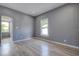 Living room with gray walls, laminate wood flooring and natural lighting at 2627 17Th N Ave, St Petersburg, FL 33713