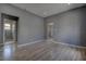 Open-concept room with sleek flooring, recessed lights, and doorway views to a bathroom at 2627 17Th N Ave, St Petersburg, FL 33713