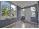 Bright sunroom with laminate floors and large windows for enjoying the outdoors at 2627 17Th N Ave, St Petersburg, FL 33713
