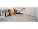 View of the carpeted bedroom filled with boxes and baby items at 30572 Thunderbird Dr, Wesley Chapel, FL 33545