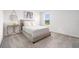 Serene bedroom featuring a comfortable bed, soft textures, natural light, and a minimalist aesthetic for relaxation at 30572 Thunderbird Dr, Wesley Chapel, FL 33545
