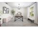Bright dining room featuring modern light fixture and cozy bench seating at 30572 Thunderbird Dr, Wesley Chapel, FL 33545