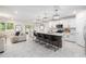 Open-concept kitchen featuring a large island and a seamless connection to the living area at 30572 Thunderbird Dr, Wesley Chapel, FL 33545