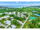 Aerial view of the community showcasing lush landscaping, community pool, and waterfront views at 3229 40Th S Ln # C, St Petersburg, FL 33711