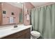 Bathroom featuring a vanity, mirror, shower with curtain, toilet and neutral colors and clean design at 3229 40Th S Ln # C, St Petersburg, FL 33711