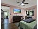 Bedroom features hard wood floors, ceiling fan, television, view to the lanai and an additional desk at 3229 40Th S Ln # C, St Petersburg, FL 33711