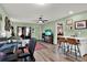 Open living area features view to a bedroom, kitchen and an outdoor patio area at 3229 40Th S Ln # C, St Petersburg, FL 33711