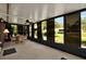 Large sunroom with plenty of natural light and views of the yard at 3229 40Th S Ln # C, St Petersburg, FL 33711