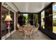 Relaxing sunroom with wicker furniture and views of the surrounding landscape at 3229 40Th S Ln # C, St Petersburg, FL 33711