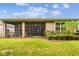 Expansive backyard with a screened-in patio, lush lawn, and manicured landscaping, offering outdoor enjoyment at 32825 Sand Creek Dr, Wesley Chapel, FL 33543