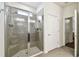 Modern bathroom featuring a glass-enclosed shower with a built-in bench and tiled walls at 32825 Sand Creek Dr, Wesley Chapel, FL 33543