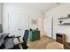 Bedroom features hardwood floors, a work space, and double doors at 32825 Sand Creek Dr, Wesley Chapel, FL 33543