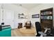 Cozy office features a comfortable leather chair, wooden bookshelf, and bright, natural light at 32825 Sand Creek Dr, Wesley Chapel, FL 33543