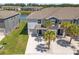 Aerial view of townhomes next to a beautiful pond and mature trees at 3334 Pleasant Willow Ct, Brandon, FL 33511
