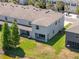 Aerial view of a backyard with a pond view and featuring a covered patio at 3334 Pleasant Willow Ct, Brandon, FL 33511