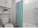 A full bath features a walk-in shower with tile surround and decorative curtain at 3334 Pleasant Willow Ct, Brandon, FL 33511