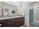 The main bathroom features double sinks, granite countertops, and walk-in shower at 3334 Pleasant Willow Ct, Brandon, FL 33511