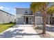 Front exterior featuring attached garages, gray paint, and a well-manicured lawn at 3334 Pleasant Willow Ct, Brandon, FL 33511