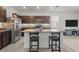 Spacious kitchen with stainless steel appliances, granite countertops and dark cabinetry at 3334 Pleasant Willow Ct, Brandon, FL 33511