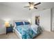 A comfortable bedroom with plush carpet, walk-in closet, and bright floral bedding at 3334 Pleasant Willow Ct, Brandon, FL 33511