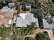 Aerial view of home showcasing new roof, landscaping, and neighborhood at 420 Roanoke St, Dunedin, FL 34698