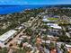 Aerial view showing the baseball field, city, and coastline at 420 Roanoke St, Dunedin, FL 34698