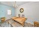 Cozy dining room featuring unique tile flooring, rustic table, and beachy accents at 420 Roanoke St, Dunedin, FL 34698