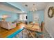 Bright living area boasting hardwood floors and a comfortable seating arrangement at 420 Roanoke St, Dunedin, FL 34698