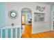 Stylishly decorated living area with hardwood floors and a clear view into the kitchen at 420 Roanoke St, Dunedin, FL 34698